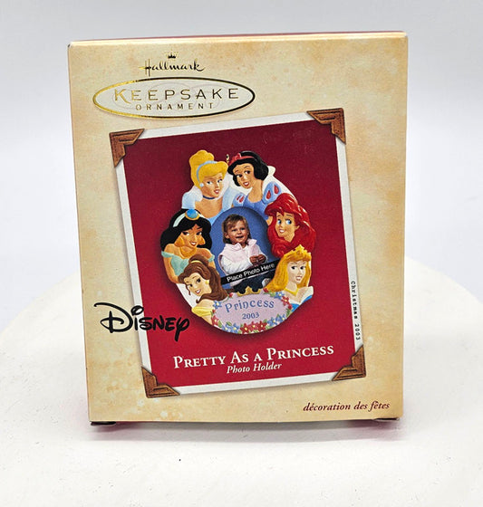 Disney Princess photo holder ornament packaging with 'Pretty As A Princess' text on a white background