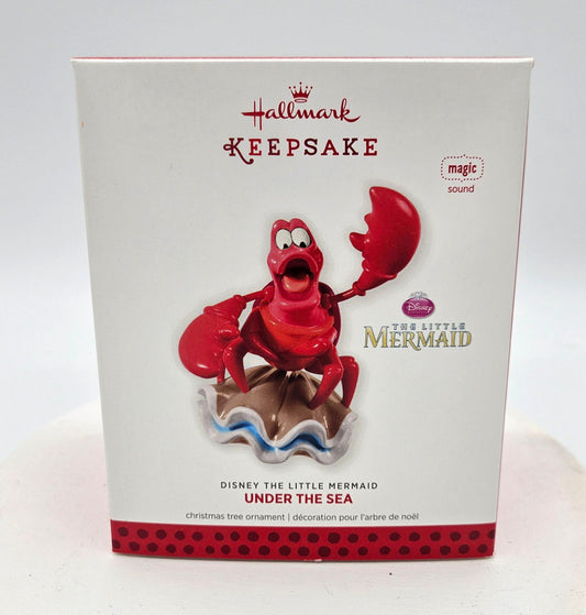 Hallmark Keepsake ornament packaging featuring a red crab character from 'The Little Mermaid'.